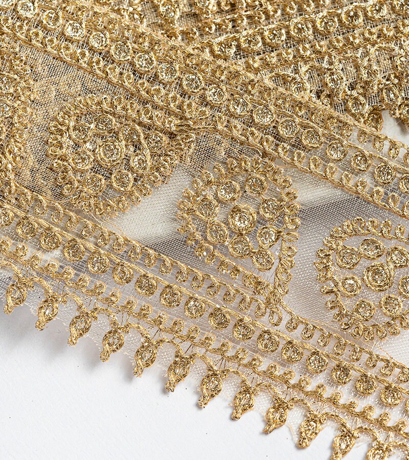Gold with zari threadwork in paisley pattern on tissue base