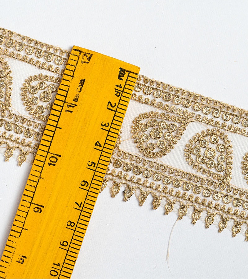 Gold with zari threadwork in paisley pattern on tissue base