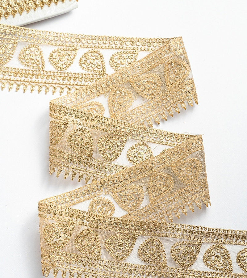Gold with zari threadwork in paisley pattern on tissue base