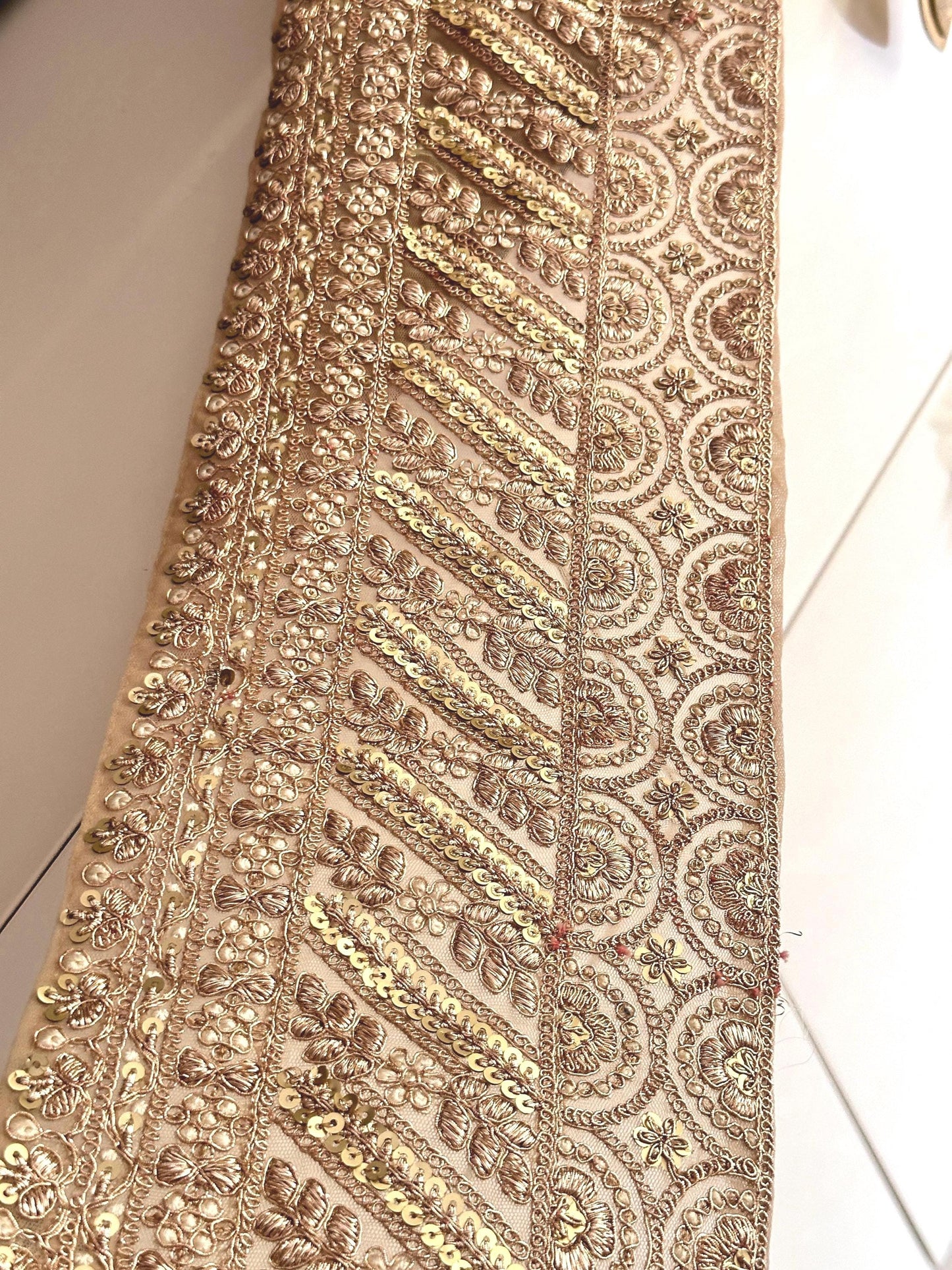 "15cm cream and gold lace trim with pearls, mirrors, and sequin embroidery, perfect for bridal and festive decor."
