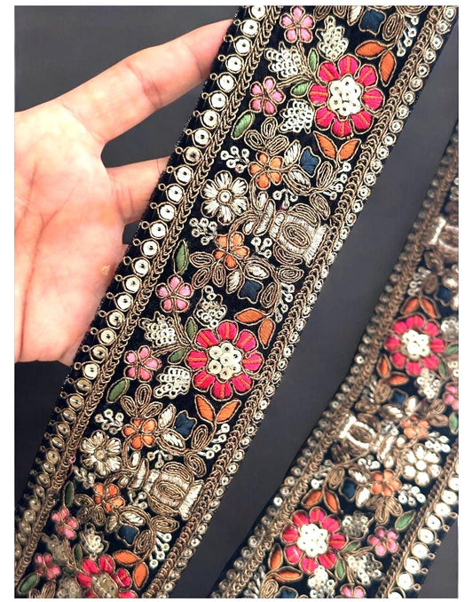 Close-up of handmade Victorian lace trim with detailed multicolour pattern and rich texture, highlighting the fine craftsmanship