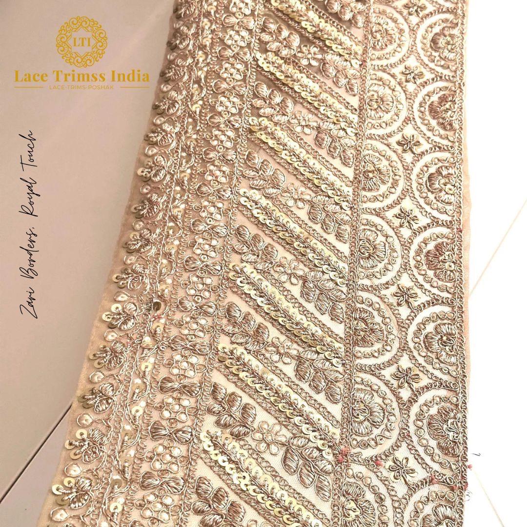 "Luxurious zari and sequin embroidered lace trim for enhancing bridal veils, wedding gowns, and evening wear."