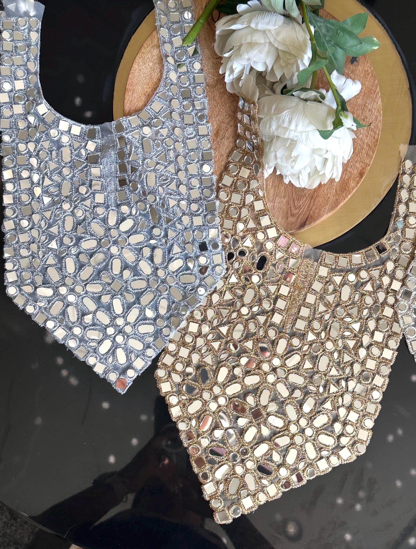 Close-up of boho chic neck patch with mirror work for wedding dresses
