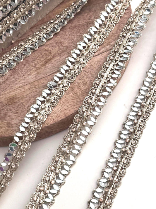 Golden mirror ribbon trim roll with sparkling accents, perfect for bridal gown detailing, lehenga embellishments, or saree edging.