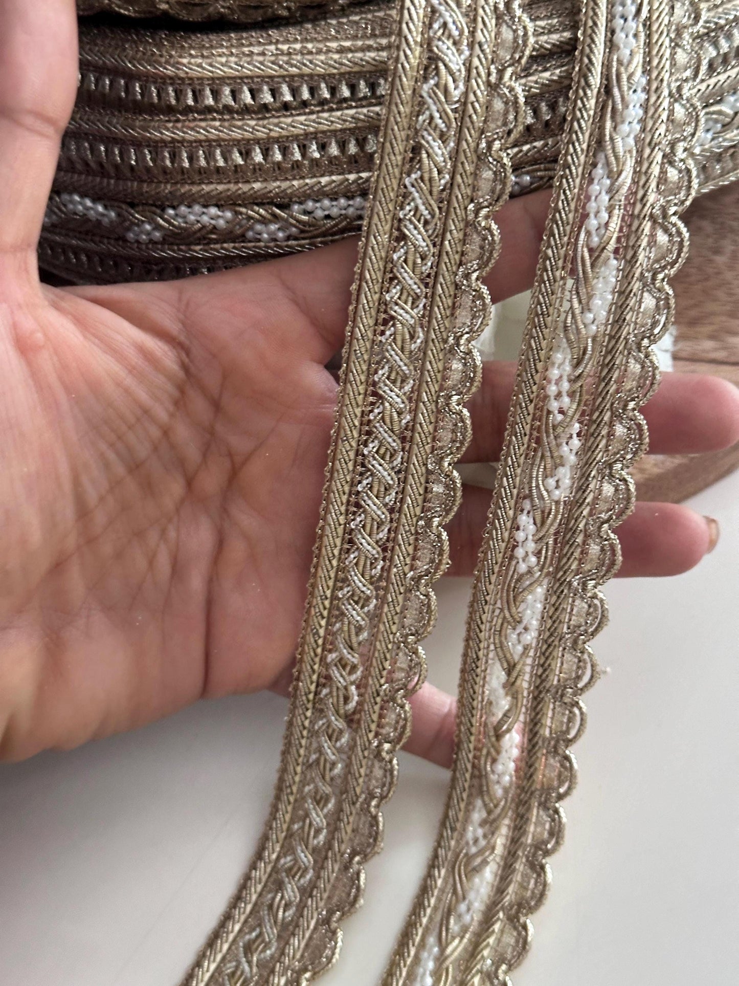 Gold crafting lace trims with pearl bead accents and scalloped edges