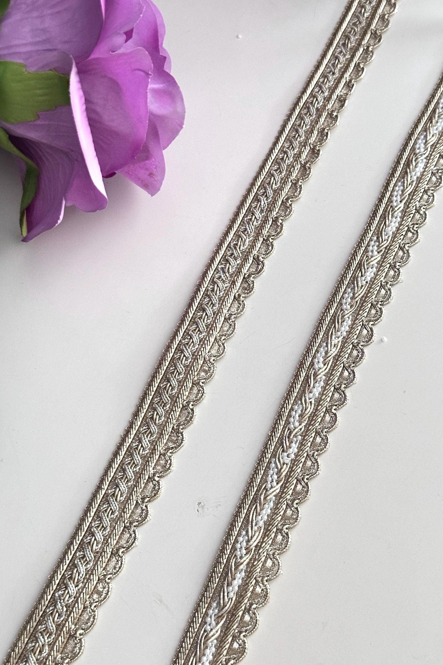 Two styles of luxury gold fabric trims for sewing and costume design.