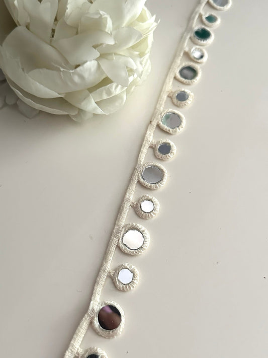 2cm lace with geometric mirror embellishments.