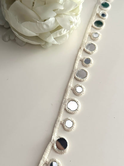 2cm cotton lace with geometric design and reflective mirrors.