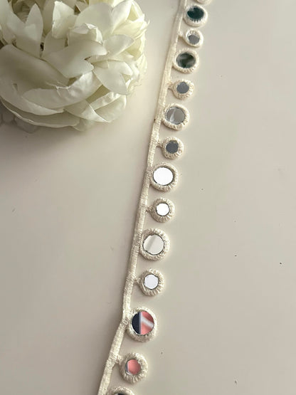 Geometric mirror lace trim used on a handmade accessory.