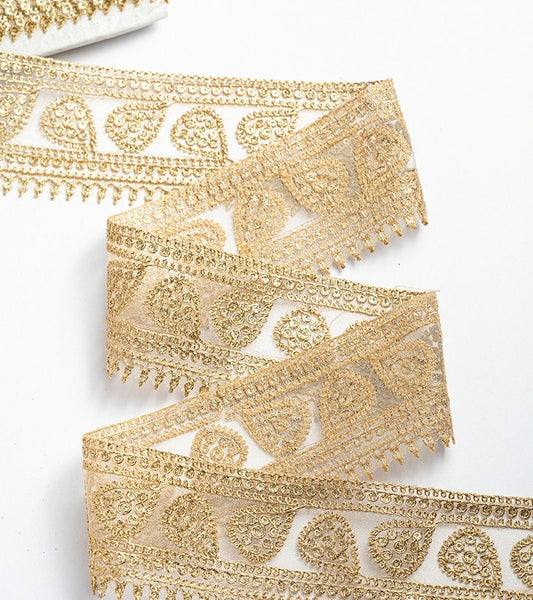 Gold with zari threadwork in paisley pattern on tissue base