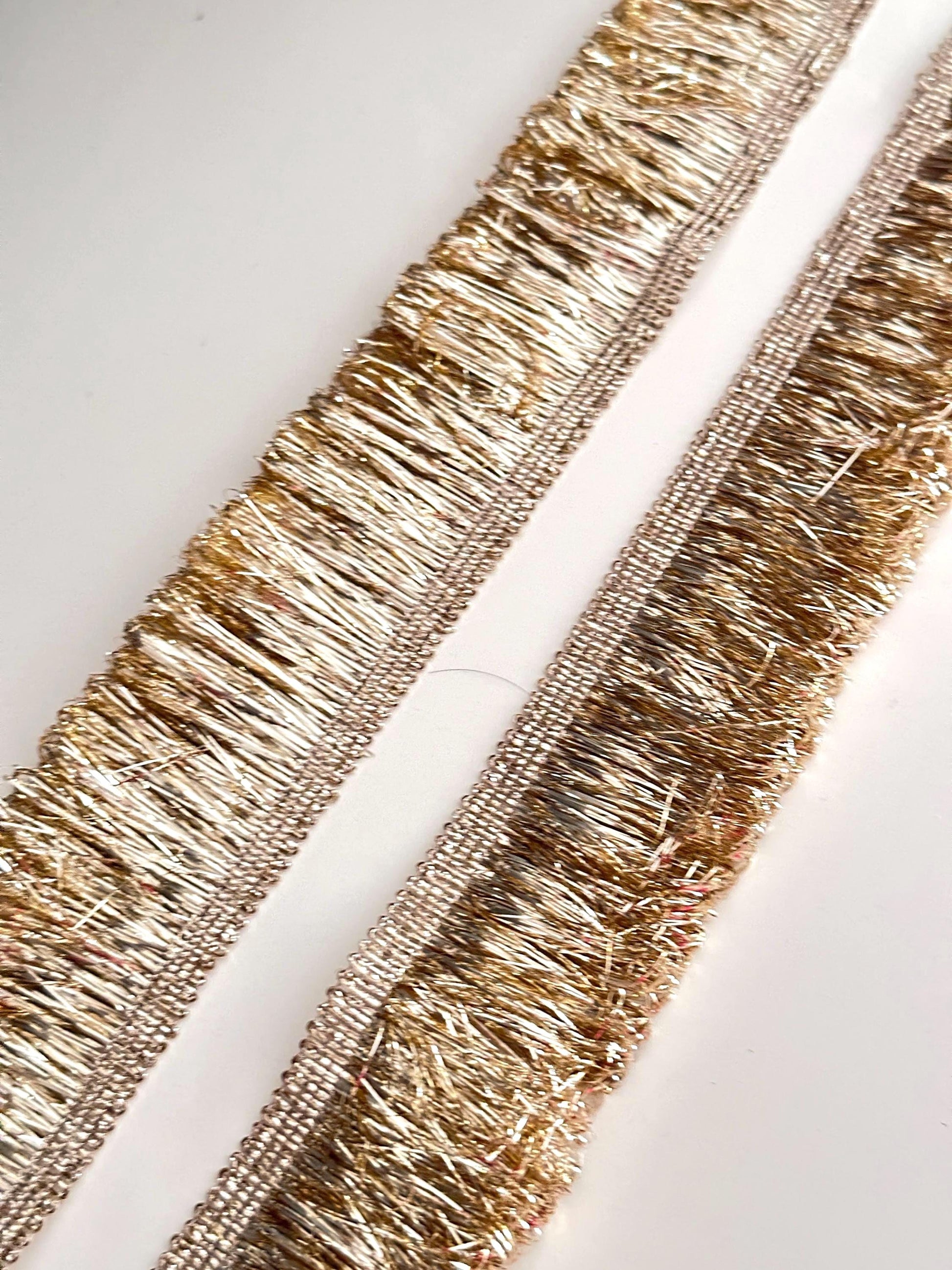 Intricate gold metallic lace with Sabyasachi-inspired border design, perfect for embellishments, special occasion decor, and creative gift wrapping