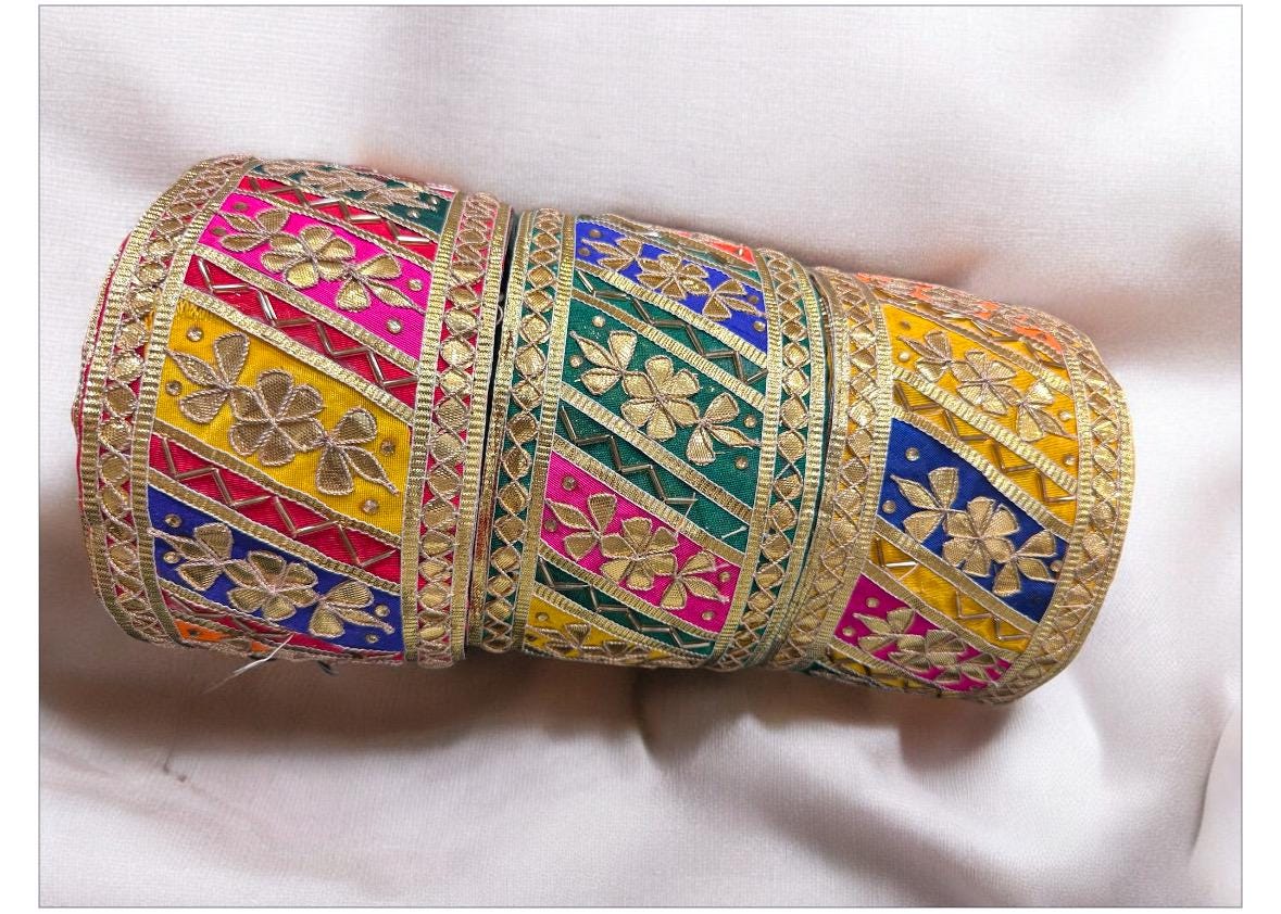 Embroidered lace trim Gota Patti lace  with colorful floral design and gold accents
Vibrant Indian lace border with intricate details
Handmade boho lace trim with unique pattern and colors