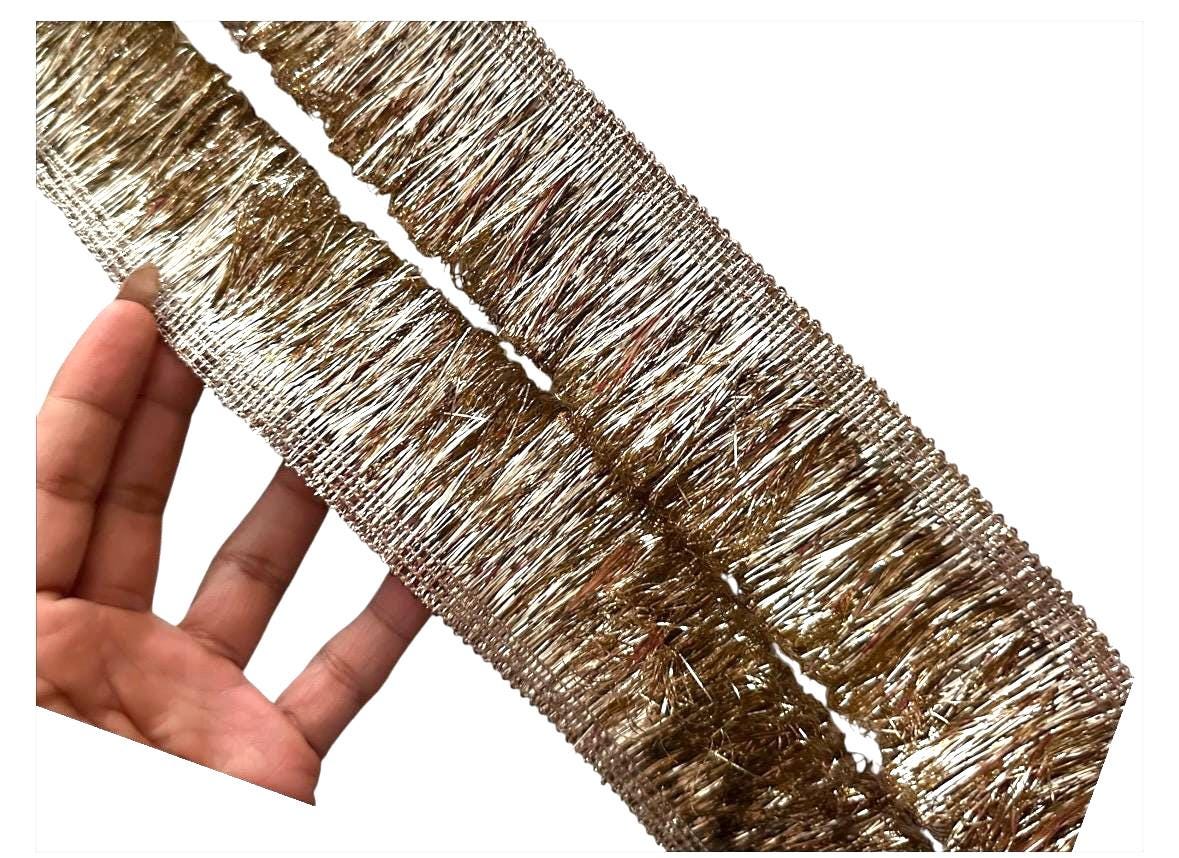 Intricate gold metallic lace with Sabyasachi-inspired border design, perfect for embellishments, special occasion decor, and creative gift wrapping