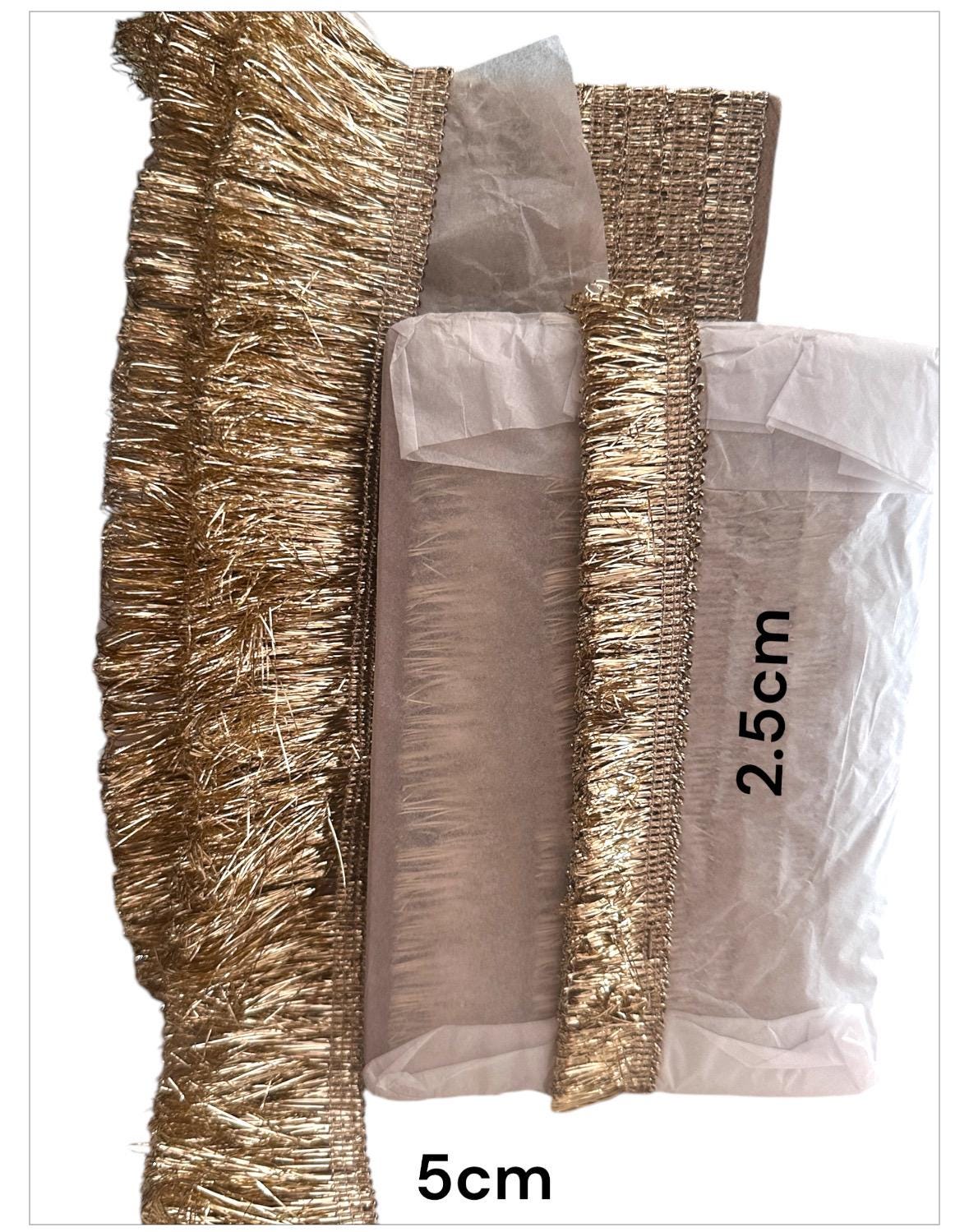 Intricate gold metallic lace with Sabyasachi-inspired border design, perfect for embellishments, special occasion decor, and creative gift wrapping